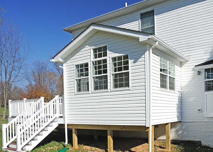 Sunroom and deck by MDV Remodeling & Custom Homes