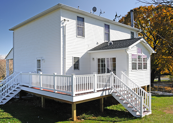 Sunroom and deck by MDV Remodeling & Custom Homes